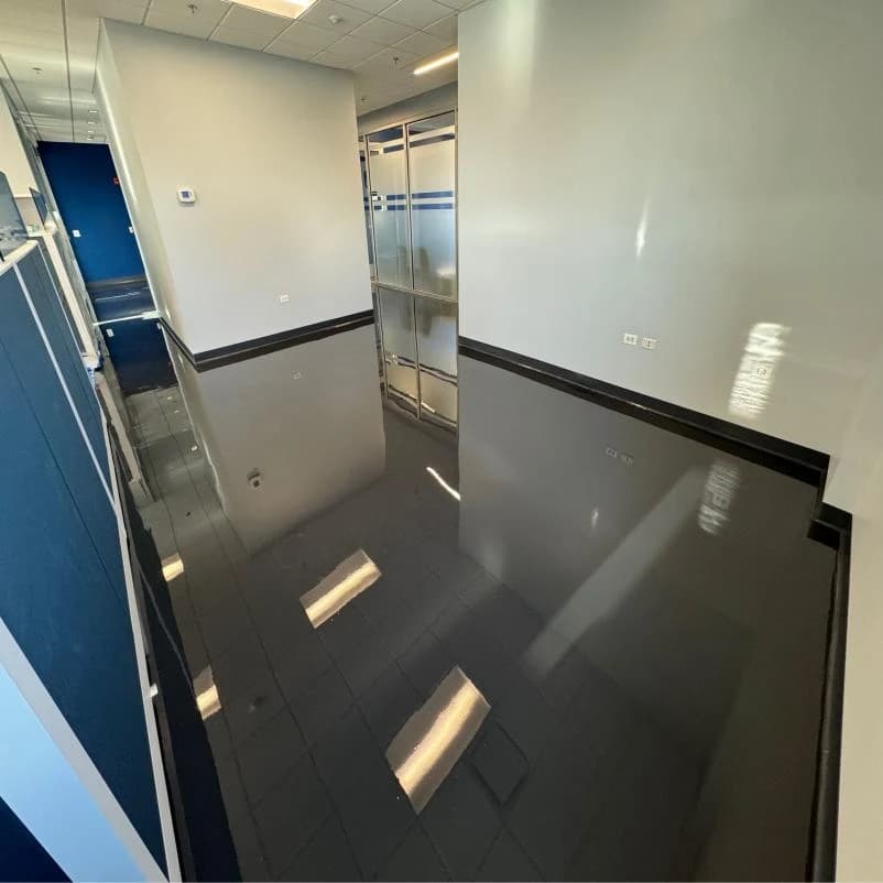 Commercial entryway with a dark high gloss epoxy floor coating