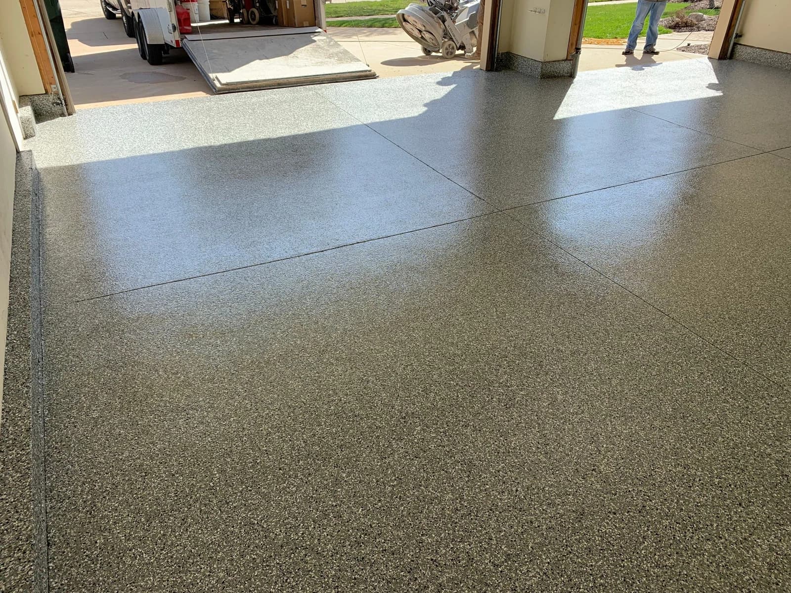 Garage floor coating viewed through the open overhead door