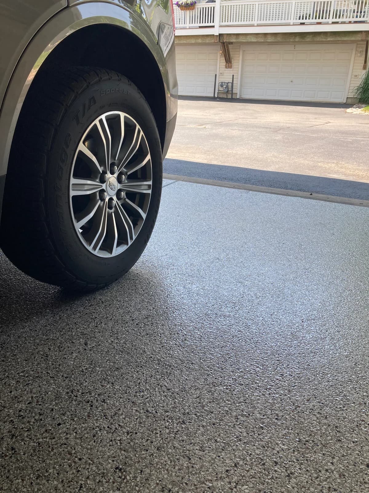 Vehicle parked on a finished flake garage floor coating