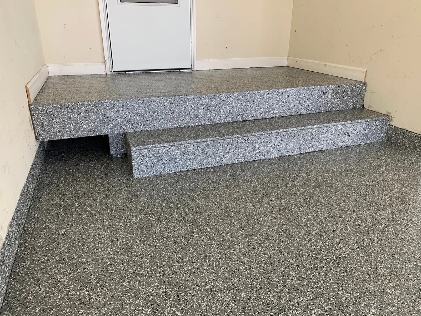 Coated interior steps and landing with a gray flake floor system