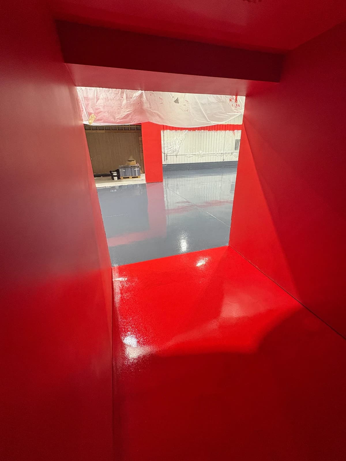 Industrial pit finished with a high gloss red epoxy floor coating