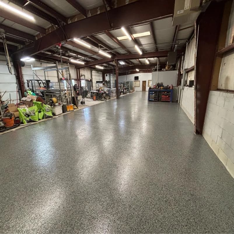 Industrial shop bay finished with a gray flake floor coating