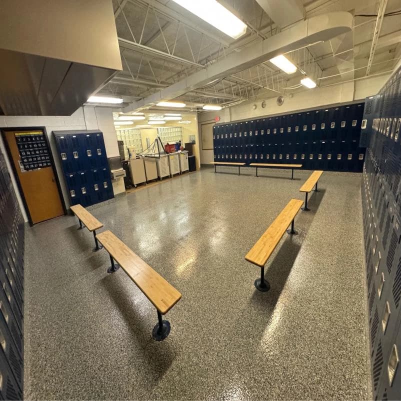 Locker room with benches on a durable flake floor coating