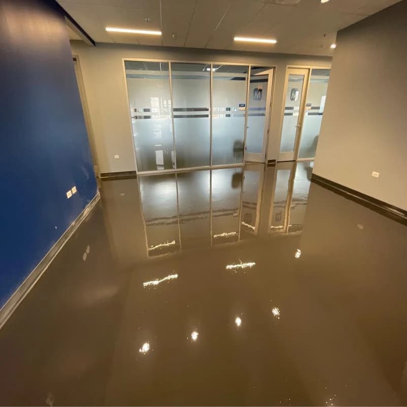 Office interior with a reflective metallic epoxy floor coating