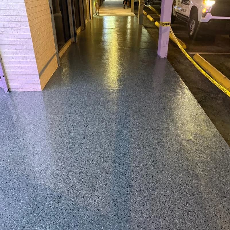 Pickleball facility walkway with a durable concrete coating