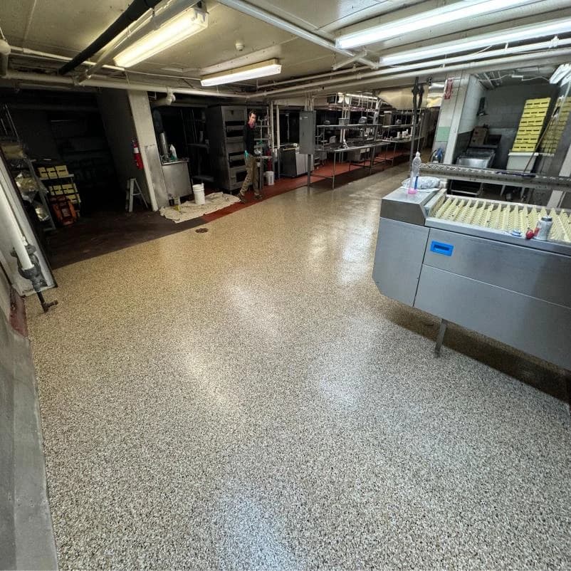 Restaurant service kitchen with a sanitary flake floor coating