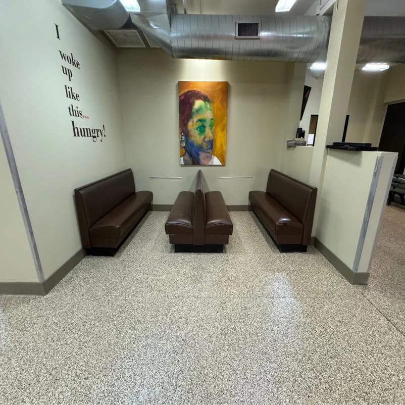 Restaurant lobby with booth seating on a flake floor coating