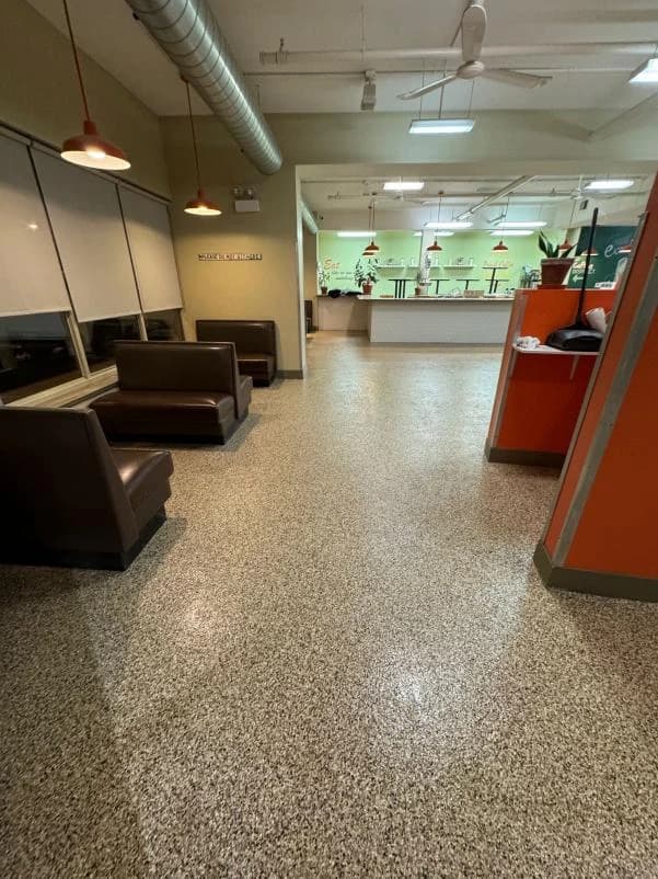 Restaurant seating area finished with a speckled flake floor coating