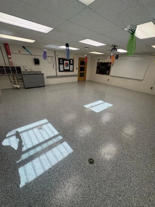 School classroom finished with a durable gray flake floor coating