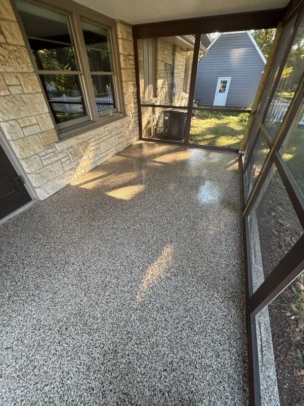Screened porch floor finished with a polyurea and polyaspartic flake coating in Northern Illinois