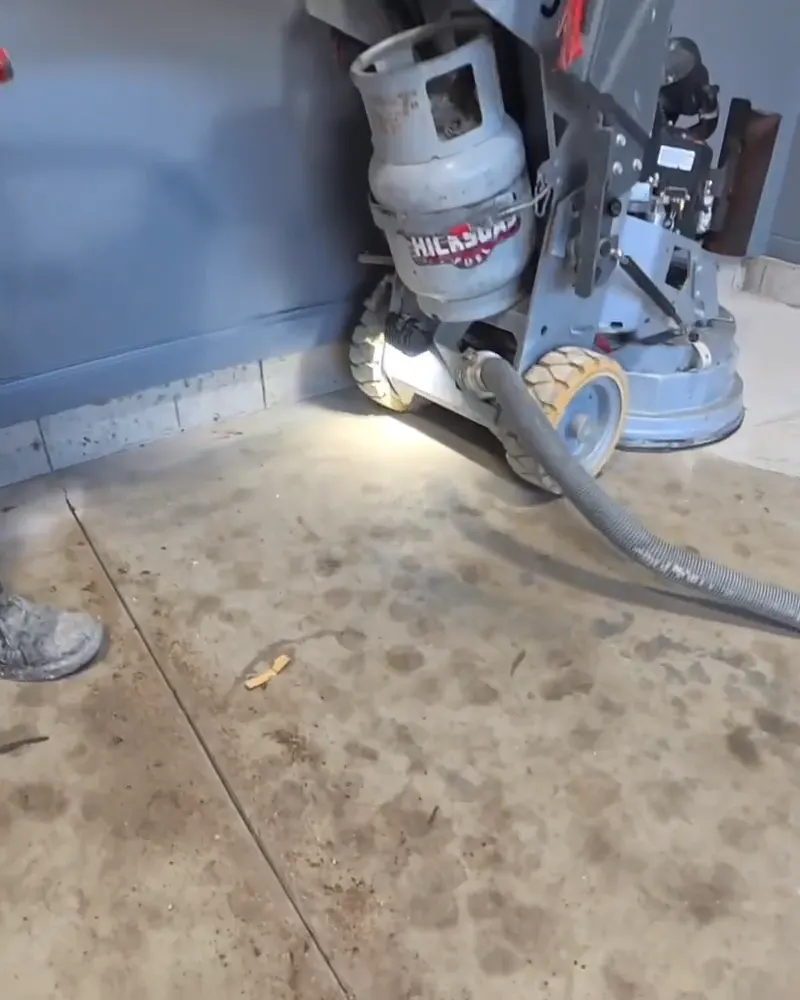 Diamond grinding a garage floor slab before the coating goes down