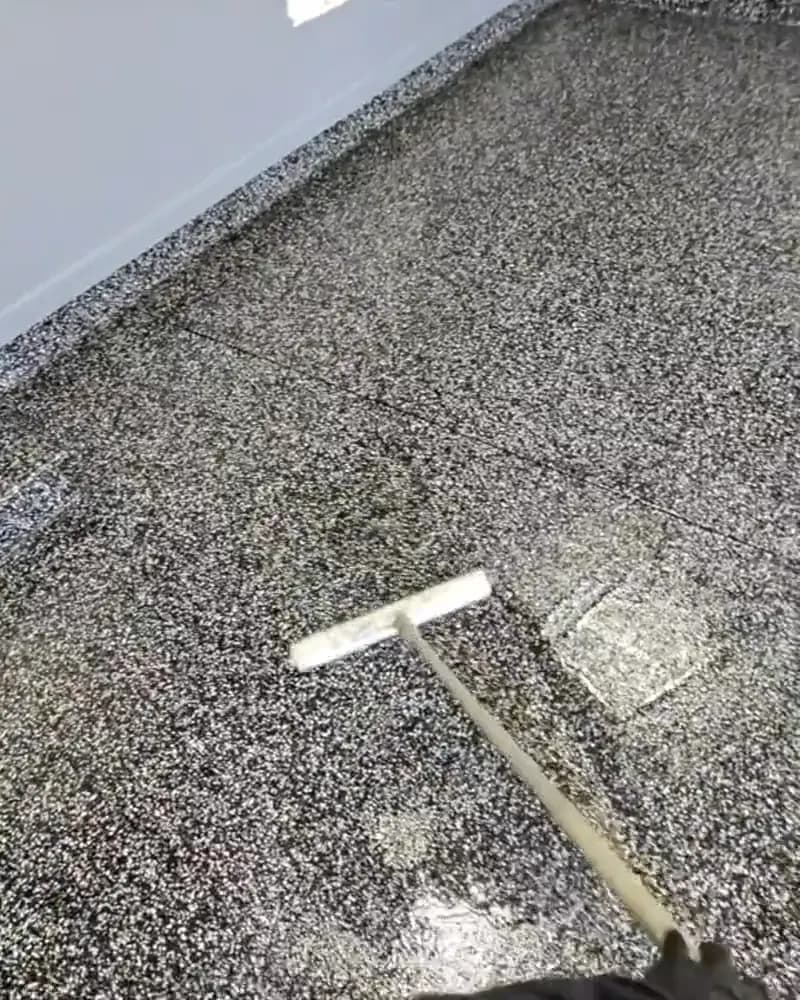 Sealing a flake garage floor under the clear polyaspartic topcoat