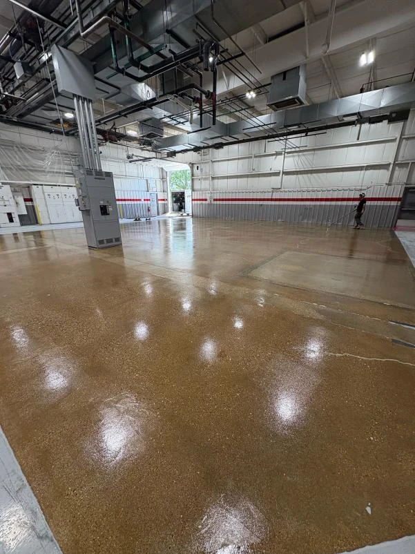 Industrial facility floor finished with a glossy commercial-grade concrete coating